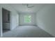 Bedroom with gray carpet, a window, and ensuite bath at 5271 Lake Forrest Dr, Atlanta, GA 30342