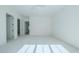 Spacious bedroom with gray carpeting and access to bathroom at 5271 Lake Forrest Dr, Atlanta, GA 30342