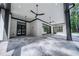 Spacious covered patio with ceiling fans and grey tile floor at 5271 Lake Forrest Dr, Atlanta, GA 30342