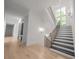 Elegant staircase with dark wood and metal railings, leading to an upper level at 5271 Lake Forrest Dr, Atlanta, GA 30342