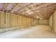 Unfinished basement with studded walls and concrete foundation awaiting customization at 7268 Eton Ln, Locust Grove, GA 30248