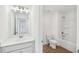Bathroom featuring a vanity and a toilet and tub shower combo at 7268 Eton Ln, Locust Grove, GA 30248