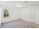 Bedroom with natural light, carpet flooring, and a scenic window view at 7268 Eton Ln, Locust Grove, GA 30248