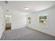 Bright bedroom boasts plush carpeting, large windows for natural light and en-suite bathroom access at 7268 Eton Ln, Locust Grove, GA 30248