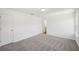 Spacious bedroom featuring plush carpeting, ample natural light, and convenient access to closet and en-suite at 7268 Eton Ln, Locust Grove, GA 30248