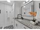 Updated bathroom with granite vanity, white subway tile, and black accents at 9404 Cypress Ln, Jonesboro, GA 30238