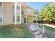 Townhome entrance with walkway and landscaping at 9404 Cypress Ln, Jonesboro, GA 30238