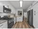 Modern kitchen with granite countertops and appliances at 9404 Cypress Ln, Jonesboro, GA 30238