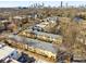 Aerial view of apartment building with city skyline in the background at 1042 Saint Charles Ne Ave # 1042-7, Atlanta, GA 30306