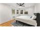 Spacious bedroom with hardwood floors and ceiling fan at 1042 Saint Charles Ne Ave # 1042-7, Atlanta, GA 30306