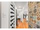 Hallway with hardwood floors and view into kitchen and bedroom at 1042 Saint Charles Ne Ave # 1042-7, Atlanta, GA 30306