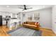 Bright living room with hardwood floors and a modern sofa at 1042 Saint Charles Ne Ave # 1042-7, Atlanta, GA 30306