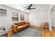 Spacious living area with hardwood floors and a comfy couch at 1042 Saint Charles Ne Ave # 1042-7, Atlanta, GA 30306