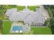 An aerial view showcasing a large home with a swimming pool, patio, and meticulously manicured lawn at 3612 Castlegate Nw Dr, Atlanta, GA 30327