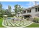 Spacious backyard with pool, patio, lounge chairs, and lush greenery at 3612 Castlegate Nw Dr, Atlanta, GA 30327