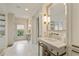 Bright bathroom featuring marble countertops, and stylish fixtures with ample space and natural light, enhancing comfort at 3612 Castlegate Nw Dr, Atlanta, GA 30327