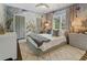 Charming bedroom with whimsical wallpaper, soft lighting, a cozy bed, and stylish decor at 3612 Castlegate Nw Dr, Atlanta, GA 30327