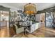 Dining room featuring an oval table, unique chairs, and artistic wallpaper at 3612 Castlegate Nw Dr, Atlanta, GA 30327