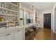 Bright home office features custom cabinets, built-in shelving, and desk overlooking the window for a cheerful workspace at 3612 Castlegate Nw Dr, Atlanta, GA 30327