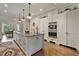 Gourmet kitchen features a large center island, custom cabinets, and modern appliances at 3612 Castlegate Nw Dr, Atlanta, GA 30327
