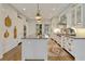 Spacious kitchen with white cabinets, center island, and stainless steel appliances at 3612 Castlegate Nw Dr, Atlanta, GA 30327