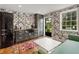 Modern kitchenette features designer wallpaper, SMEG refrigerator, and sleek countertops at 3612 Castlegate Nw Dr, Atlanta, GA 30327