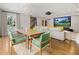 Open-plan living room features a dining area, large sectional, and projector screen at 3612 Castlegate Nw Dr, Atlanta, GA 30327