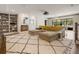 Spacious living room offers a brick fireplace and modern light fixture at 3612 Castlegate Nw Dr, Atlanta, GA 30327