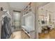Mud room has a built-in bench with storage and decorative shelving to keep the space organized and welcoming at 3612 Castlegate Nw Dr, Atlanta, GA 30327