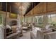 Charming screened porch with cozy seating and a fireplace, providing a serene space to enjoy the wooded scenery at 3612 Castlegate Nw Dr, Atlanta, GA 30327