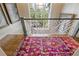 Bright stairway featuring a colorful rug, modern railing, and natural light, creating an inviting entrance at 3612 Castlegate Nw Dr, Atlanta, GA 30327