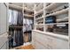 Organized walk-in closet with built-in shelves and drawers providing ample storage space at 3612 Castlegate Nw Dr, Atlanta, GA 30327