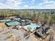 Aerial view of community with tennis courts, swimming pool, and clubhouse amenities at 4927 Slaton Drive, Acworth, GA 30101