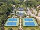 Aerial view showcasing community pool, tennis courts, clubhouse and surrounding landscape at 4927 Slaton Drive, Acworth, GA 30101
