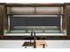 Wet bar featuring a sink and bar refrigeration, set against a wall of large screen TVs at 4927 Slaton Drive, Acworth, GA 30101