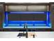 Wet bar featuring a sink and bar refrigeration, set against a wall of large screen TVs at 4927 Slaton Drive, Acworth, GA 30101