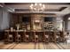 A fully stocked, upscale bar with wood paneling, leather stools, and multiple televisions for entertainment at 4927 Slaton Drive, Acworth, GA 30101