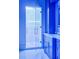 Modern bathroom featuring a glass shower door and custom blue cabinets with marble countertops at 4927 Slaton Drive, Acworth, GA 30101