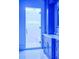 Modern bathroom featuring a glass shower door and custom blue cabinets with marble countertops at 4927 Slaton Drive, Acworth, GA 30101