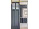Gray bathroom features a sliding door, custom cabinets, marble countertops and backsplash, and sleek fixtures at 4927 Slaton Drive, Acworth, GA 30101