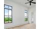 Spacious bedroom with ample natural light, accented by a ceiling fan, complemented by a neutral palette and open layout at 4927 Slaton Drive, Acworth, GA 30101