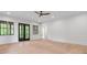 Large open bedroom with wood floors, black framed windows, and neutral paint at 4927 Slaton Drive, Acworth, GA 30101