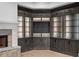 Elegant built-in shelving with glass doors and ambient lighting provides ample storage and display space at 4927 Slaton Drive, Acworth, GA 30101