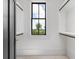 Bright closet features adjustable shelving and a window with a scenic outdoor view at 4927 Slaton Drive, Acworth, GA 30101