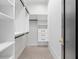 Walk-in closet featuring custom shelving, drawers, and ample storage space for an organized wardrobe at 4927 Slaton Drive, Acworth, GA 30101