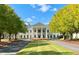 Elegant club house with classic columns, flagpole, and manicured lawn, a centerpiece of the community at 4927 Slaton Drive, Acworth, GA 30101