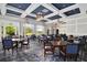 Well-lit dining area featuring views of the grounds, and several tables ready for entertaining at 4927 Slaton Drive, Acworth, GA 30101