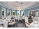 Elegant dining room with a chandelier, light blue walls, and ample seating for formal occasions at 4927 Slaton Drive, Acworth, GA 30101