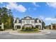 Elegant two-story home featuring a circular driveway, manicured landscaping, and a grand entrance at 4927 Slaton Drive, Acworth, GA 30101