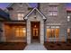 Beautiful stone front entrance with a dark wood door at 4927 Slaton Drive, Acworth, GA 30101